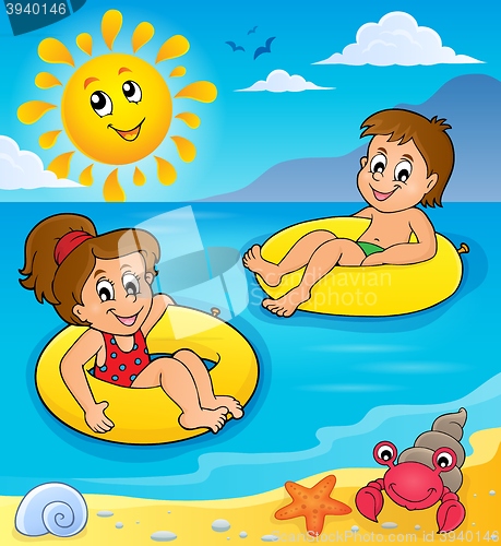 Image of Children in swim rings image 2