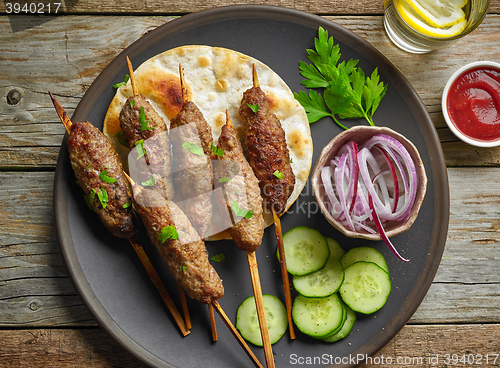 Image of grilled minced meat skewers kebabs