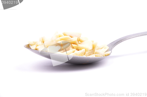 Image of Almond slivers on spoon