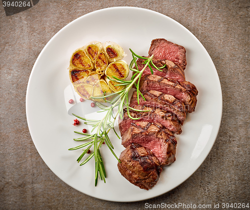 Image of grilled steak on white plate