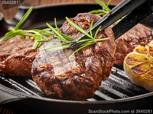 Image of beef steak on cooking pan