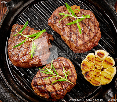 Image of beef steak on cooking pan