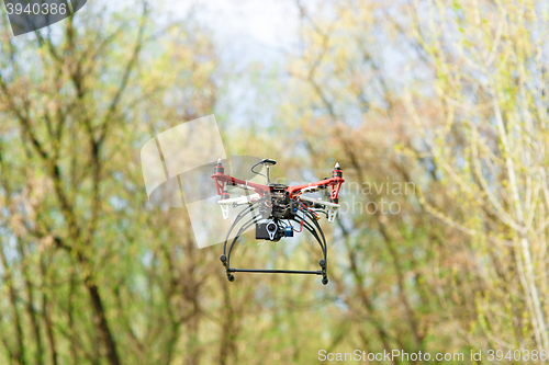 Image of Quadrocopter while flying in the forest. 