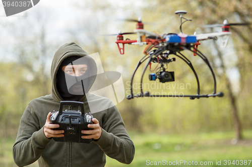 Image of Man flying with the drone