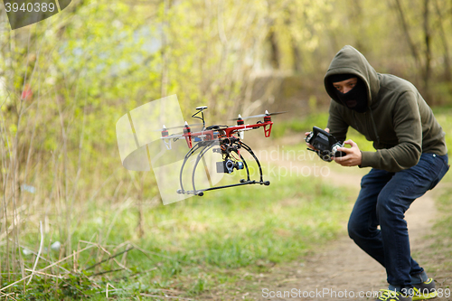 Image of Man flying with the drone