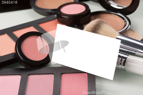 Image of makeup cosmetics for eyes and bussiness card