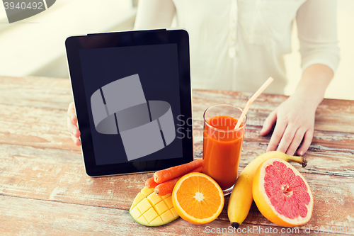 Image of close up of woman hands with juice and fruits