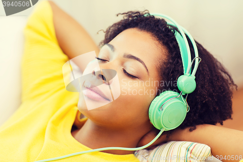 Image of happy woman with headphones listening to music