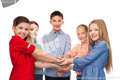 Image of happy children with hands on top