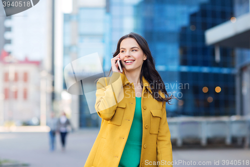 Image of smiling young woman or girl calling on smartphone