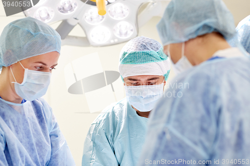 Image of group of surgeons in operating room at hospital