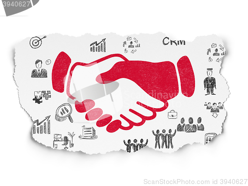 Image of Business concept: Handshake on Torn Paper background