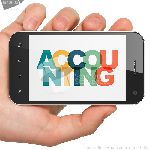 Image of Banking concept: Hand Holding Smartphone with Accounting on  display