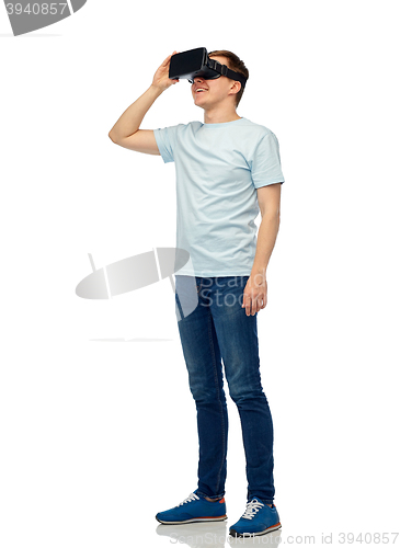 Image of happy man in virtual reality headset or 3d glasses