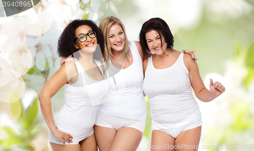 Image of group of happy plus size women in white underwear