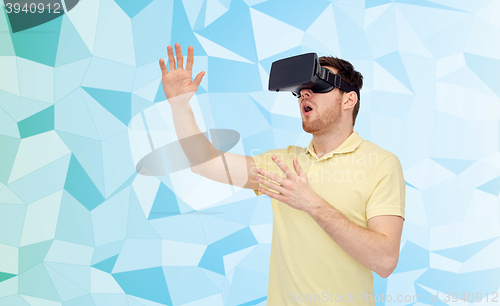 Image of young man in virtual reality headset or 3d glasses