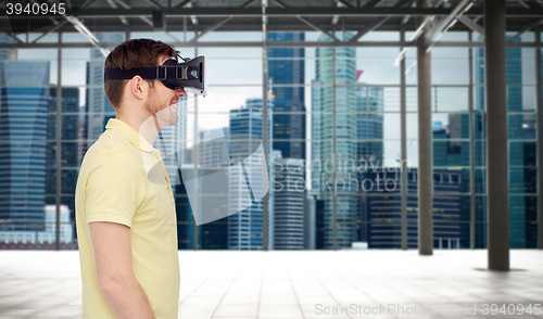 Image of happy man in virtual reality headset or 3d glasses
