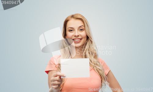 Image of happy woman or teen girl with blank white paper