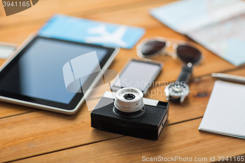 Image of close up of camera, gadgets and personal stuff