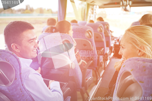 Image of group of happy passengers in travel bus