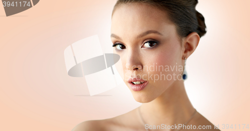 Image of close up of beautiful woman face with earring