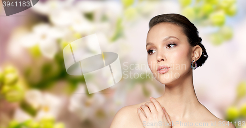 Image of close up of beautiful woman face with earring