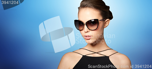 Image of beautiful young woman in elegant black sunglasses