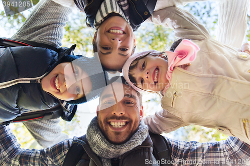 Image of happy family faces outdoors at camp in woods