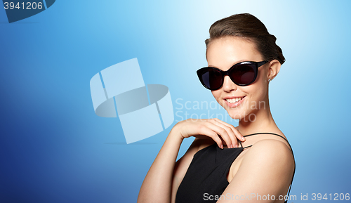 Image of beautiful young woman in elegant black sunglasses