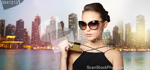 Image of beautiful young woman in elegant black sunglasses