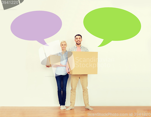 Image of couple with cardboard boxes moving to new home
