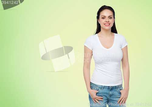 Image of happy young woman or teenage girl in white t-shirt