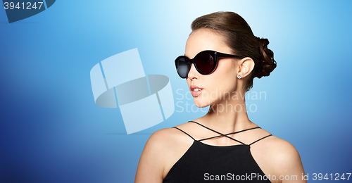 Image of beautiful young woman in elegant black sunglasses