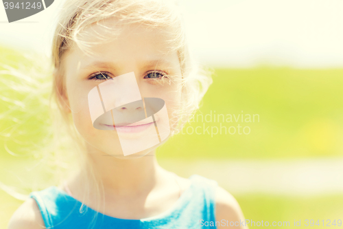 Image of happy little girl outdoors at summer