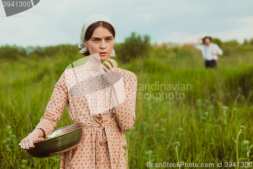 Image of The healthy rural life. The woman in the green field