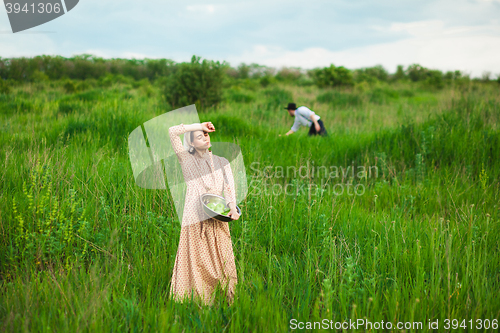 Image of The healthy rural life. The woman in the green field