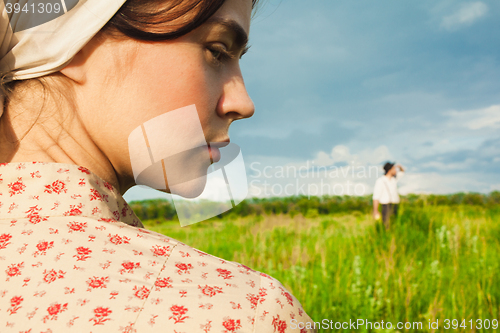 Image of The healthy rural life. The woman and man in the green field