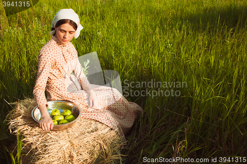 Image of The healthy rural life. The woman in the green field