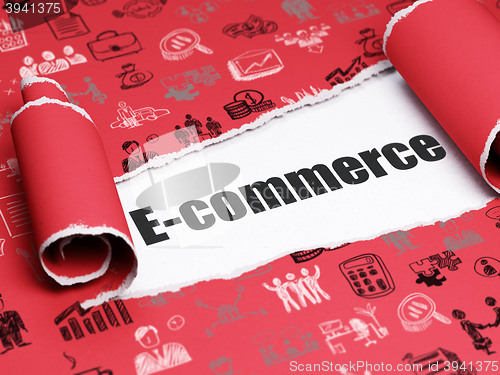 Image of Business concept: black text E-commerce under the piece of  torn paper