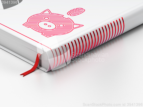 Image of Money concept: closed book, Money Box With Coin on white background