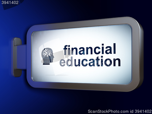 Image of Education concept: Financial Education and Head With Finance Symbol on billboard background