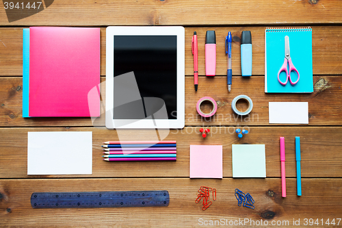 Image of close up of school supplies and tablet pc