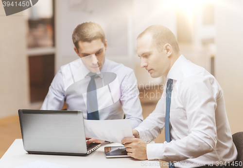 Image of two businessmen having discussion in office