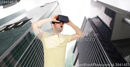 Image of happy man in virtual reality headset or 3d glasses