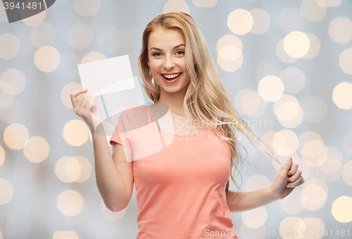 Image of happy woman or teen girl with blank white paper