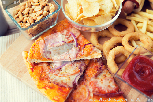 Image of close up of fast food snacks and drink on table