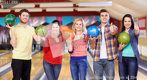 Image of happy friends in bowling club