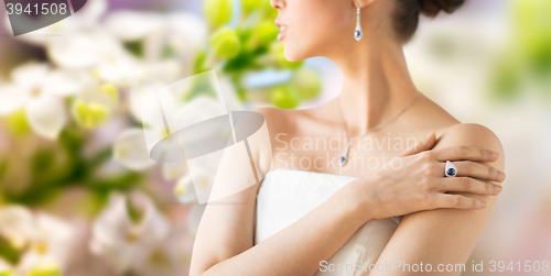 Image of close up of beautiful woman with finger ring