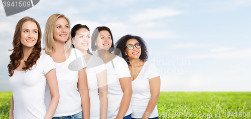 Image of group of happy different women in white t-shirts