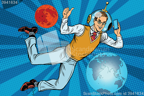 Image of Space businessman with smartphone over the planet Earth and Mars